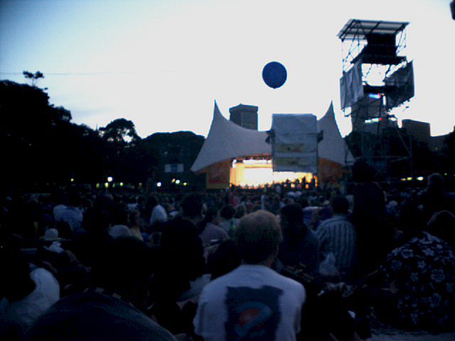 Somewhere in the middle distance, the band strikes up.